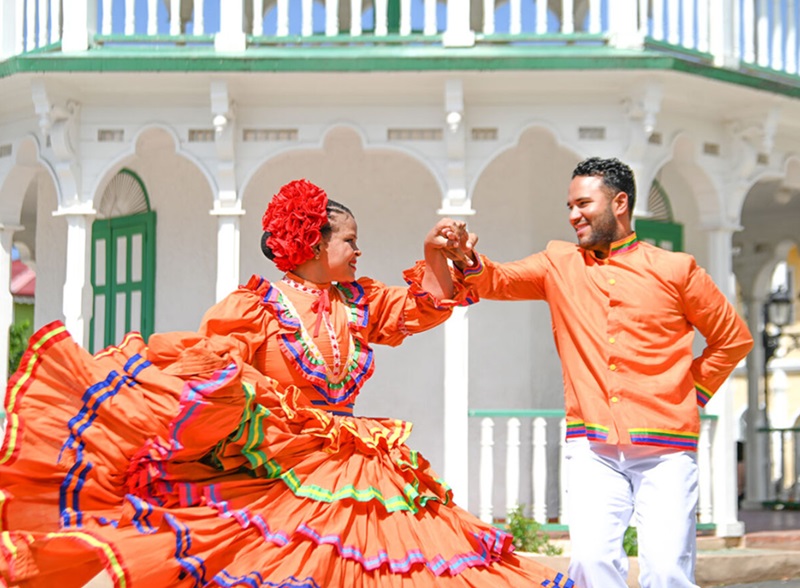 Couple dancing merengue outdoors